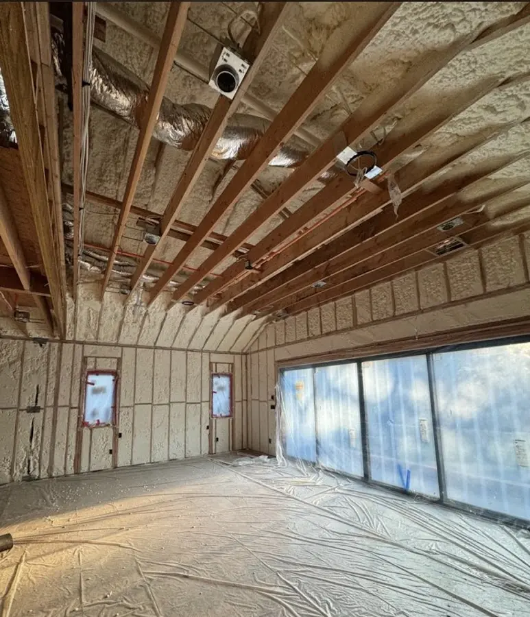 Interior walls and ceiling insulated with spray foam during new construction in Wells Branch